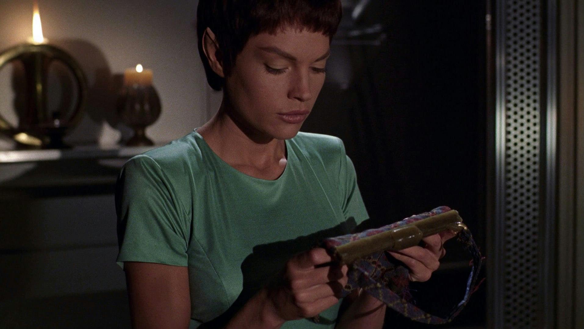 T'Pol holds her grandmother T'Mir's purse after telling her story.