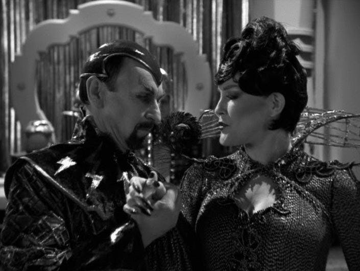 Dr. Chaotica pulls Janeway as Arachnia in close as he shows her around in 'Bride of Chaotica!'