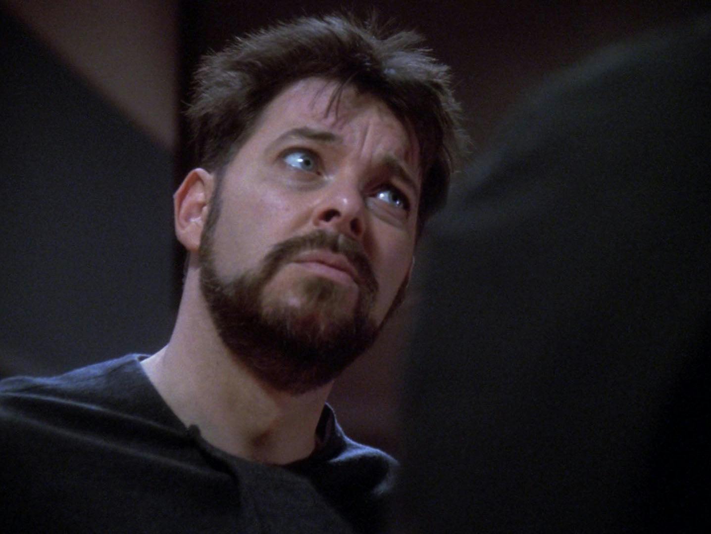 Riker looks disheveled as he sits in a chair.