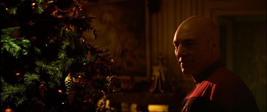 Picard in front of the Christmas tree in Star Trek: Generations
