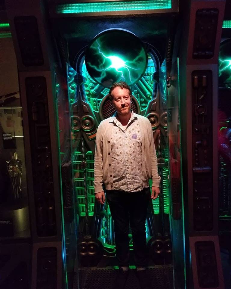 Asher Huey stands inside a Borg regeneration alcove.