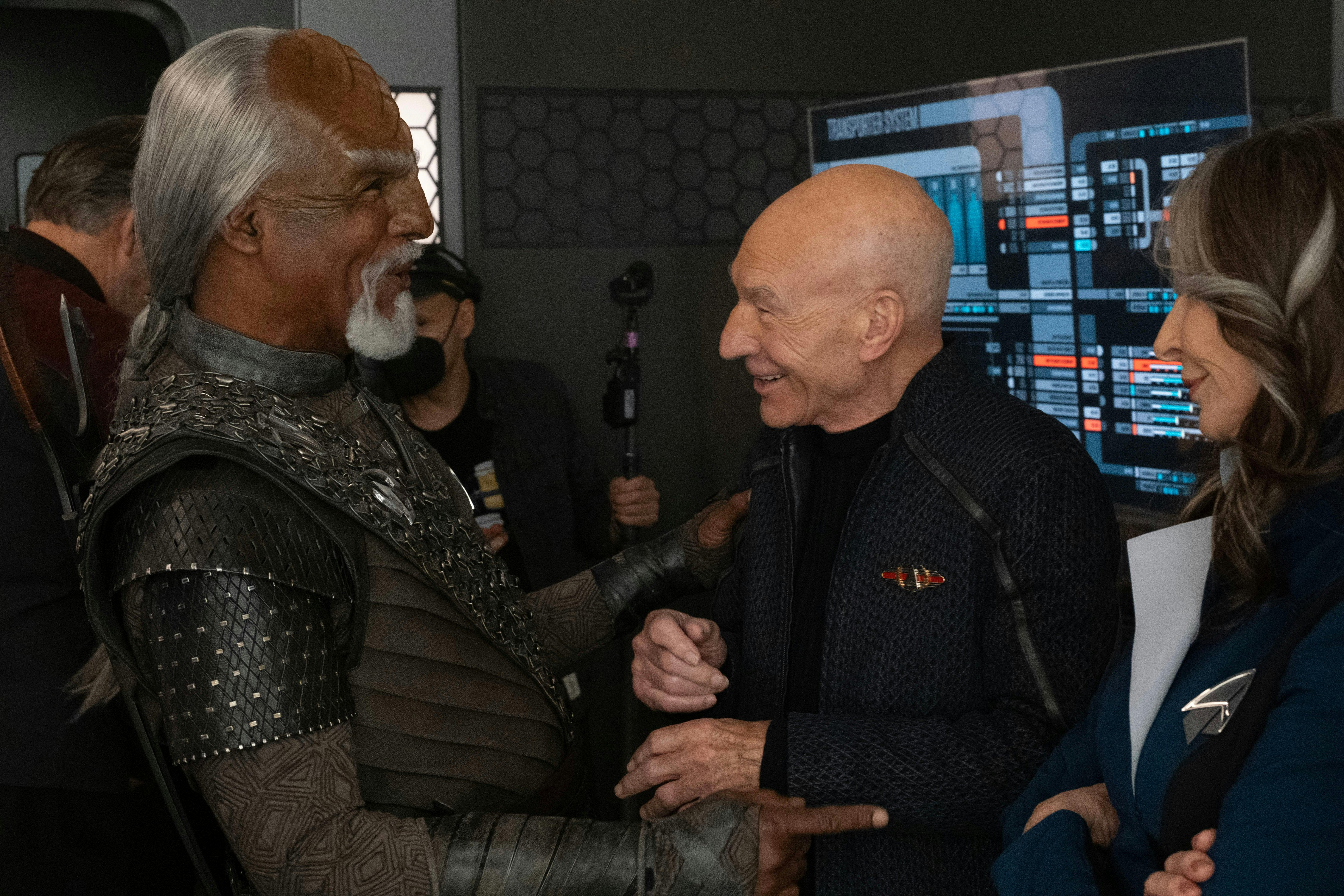 Star Trek: Picard BTS still - a candid moment between Michael Dorn, Patrick Stewart, and Gates McFadden