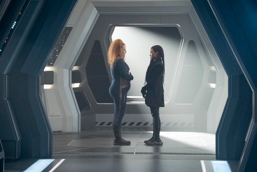 Tilly and Burnham stand face-to-face in the corridor intersection of the Discovery in 'People of Earth'