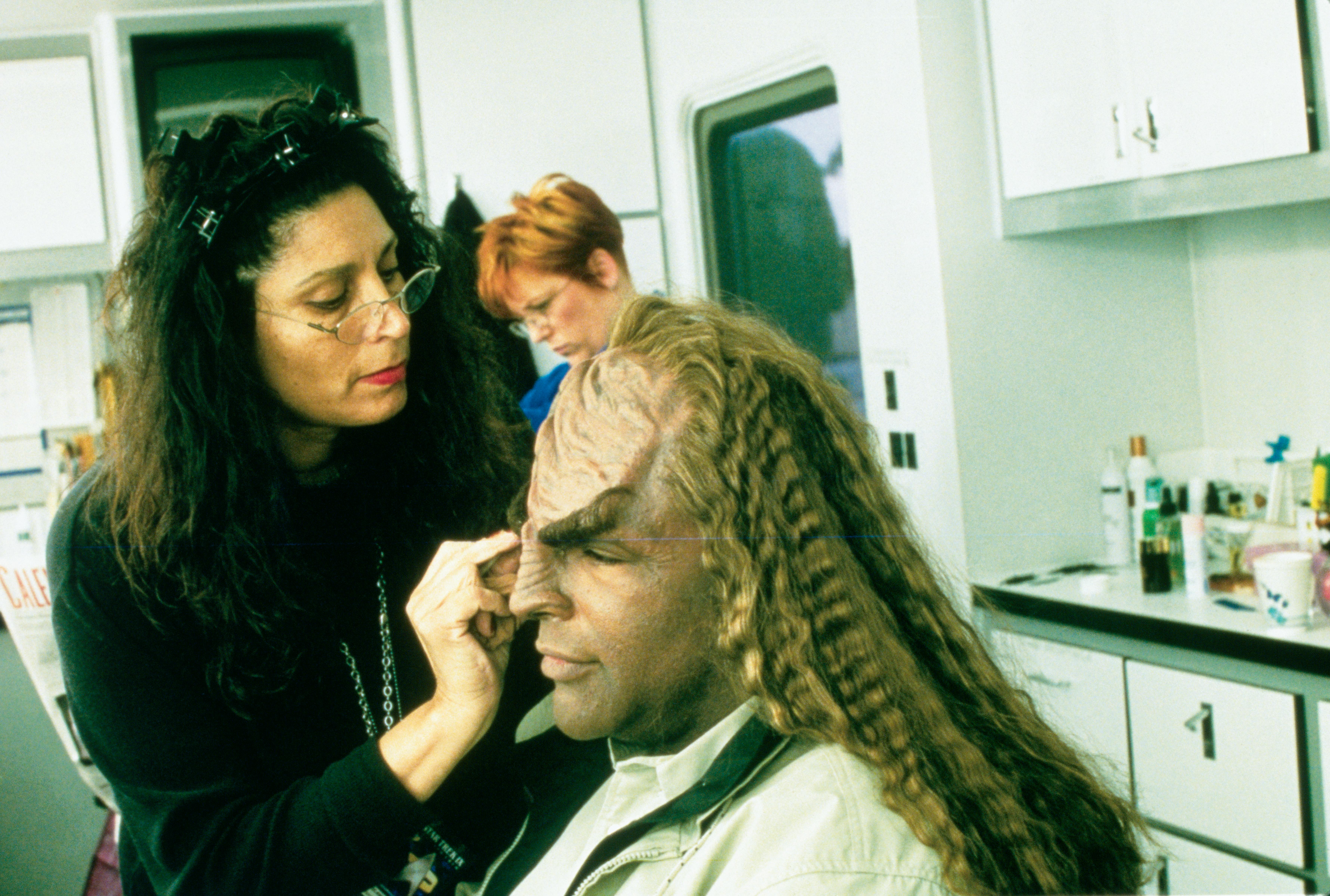 In the make-up trailer putting final touches on Michael Dorn on set for Star Trek: Insurrection