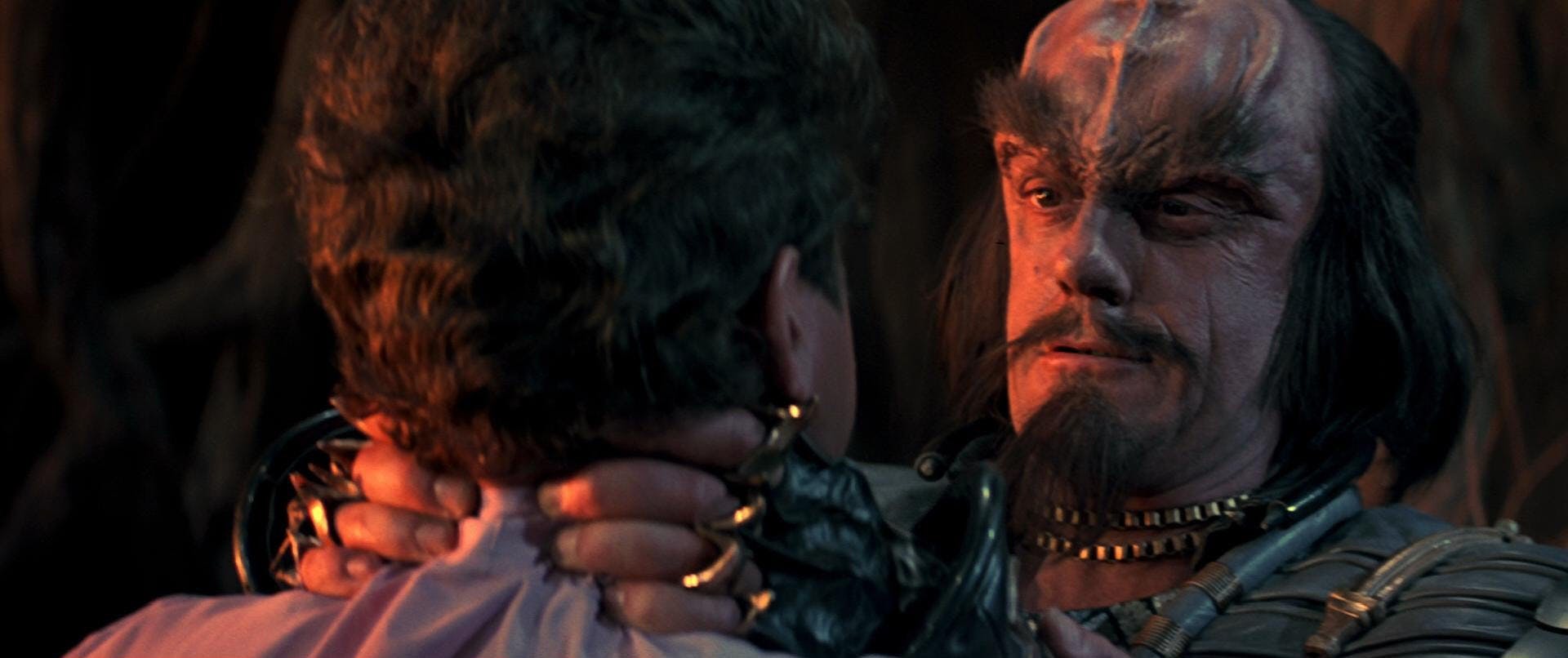 Still of Christopher Lloyd as Kruge with both of his hands around Kirk's neck choking him in Star Trek III: The Search for Spock
