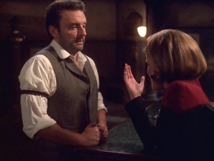 Janeway proposes an arm wrestle with the holonovel bartender in 'Fair Haven'