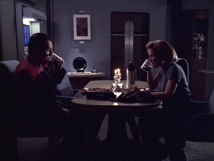 Chakotay and Janeway both drink coffee at dinner in 'The Voyager Conspiracy'