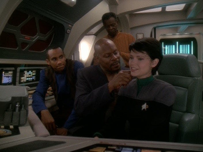 On the U.S.S. Rio Grande, Jake and Joseph Sisko are near as Ben Sisko treats Ezri Dax for space sickness