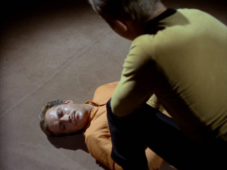 James T. Kirk kneels over his deceased brother Sam Kirk in 'Operation -- Annihilate!'