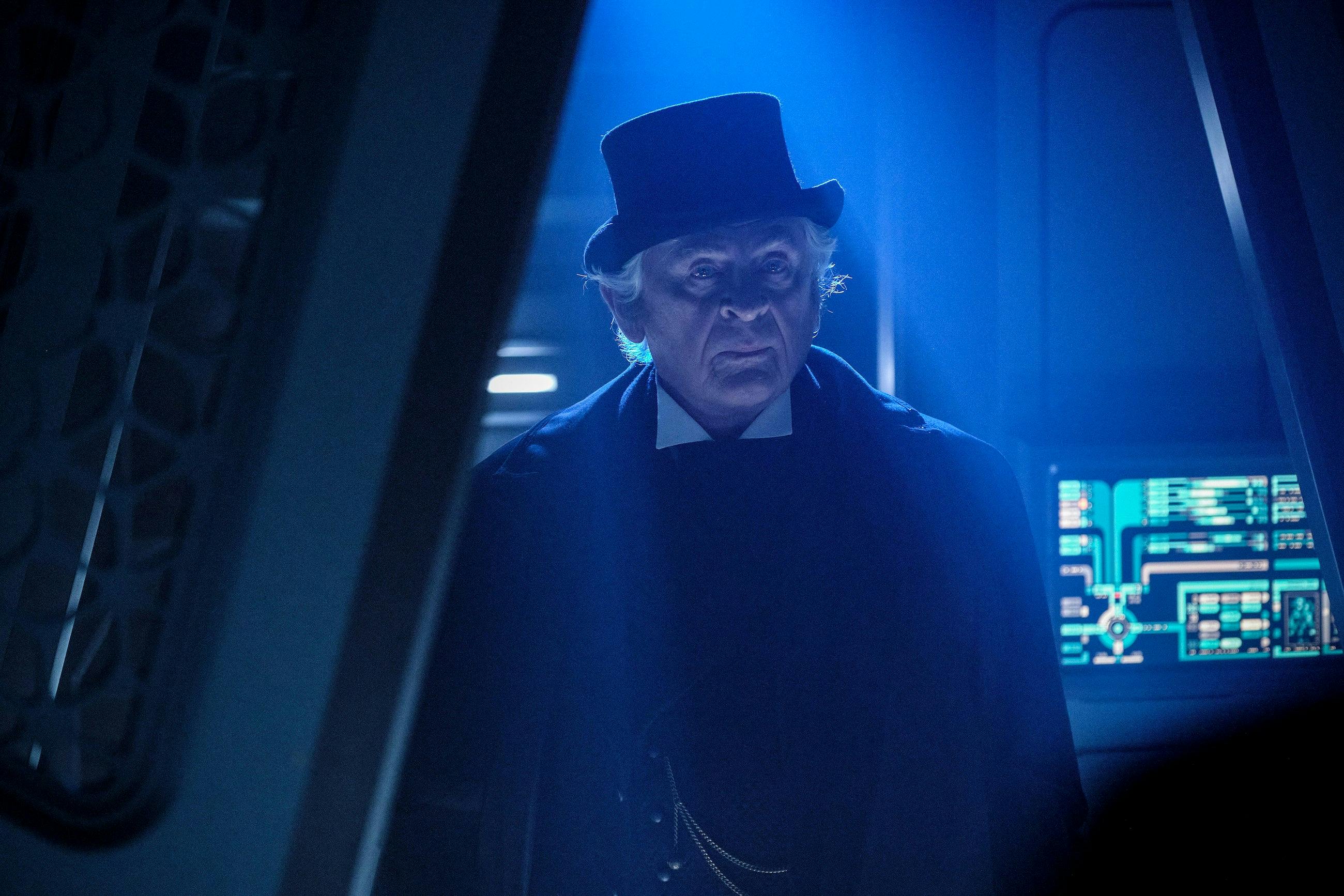 Professor James Moriarty stands in the corridor of Daystrom Station