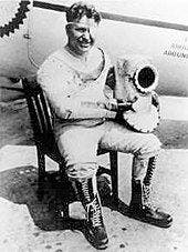 Wiley Post sits in the third version his pressure suit. 