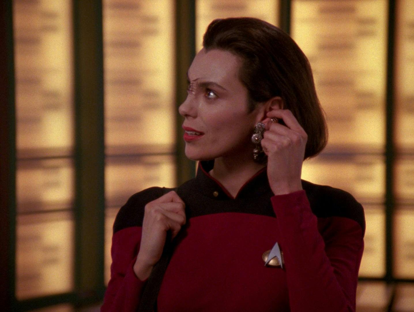 Ensign Ro Laren touches her ear to remove her Bajoran earring