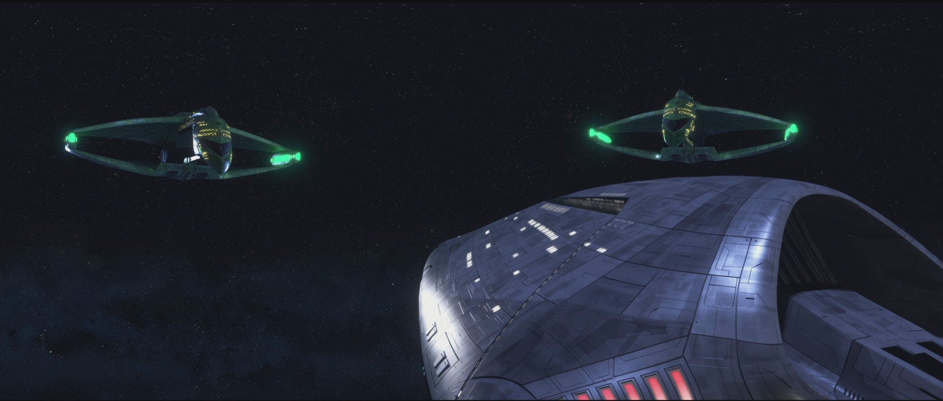 Two Romulan warbirds guard the Neutral Zone.