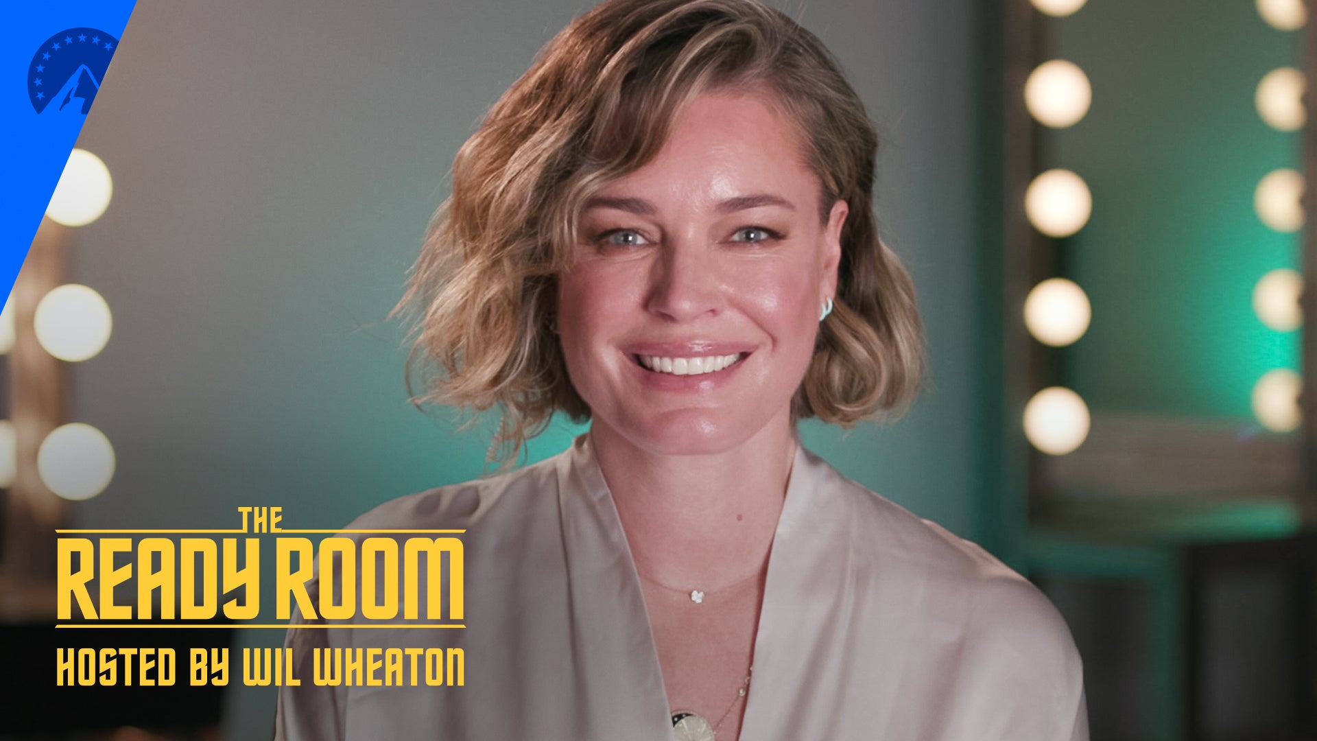 Close up of Rebecca Romijn on the set of The Ready Room to talk about Star Trek: Strange New Worlds