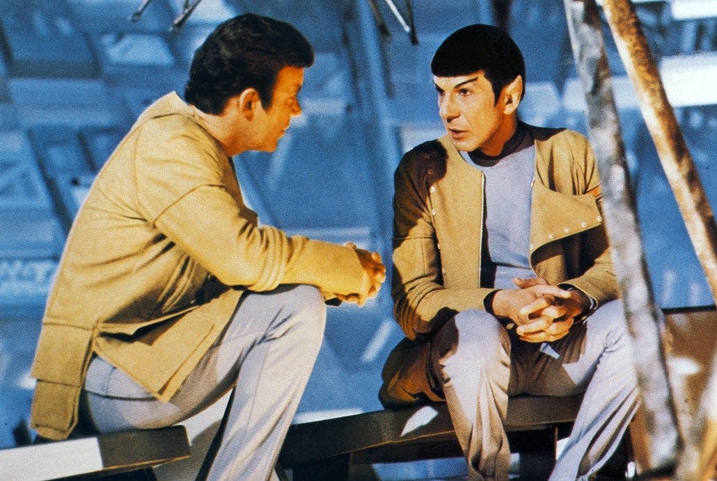 Behind-the-scenes glimpse of William Shatner and Leonard Nimoy in costume sitting on the set of Star Trek: The Motion Picture