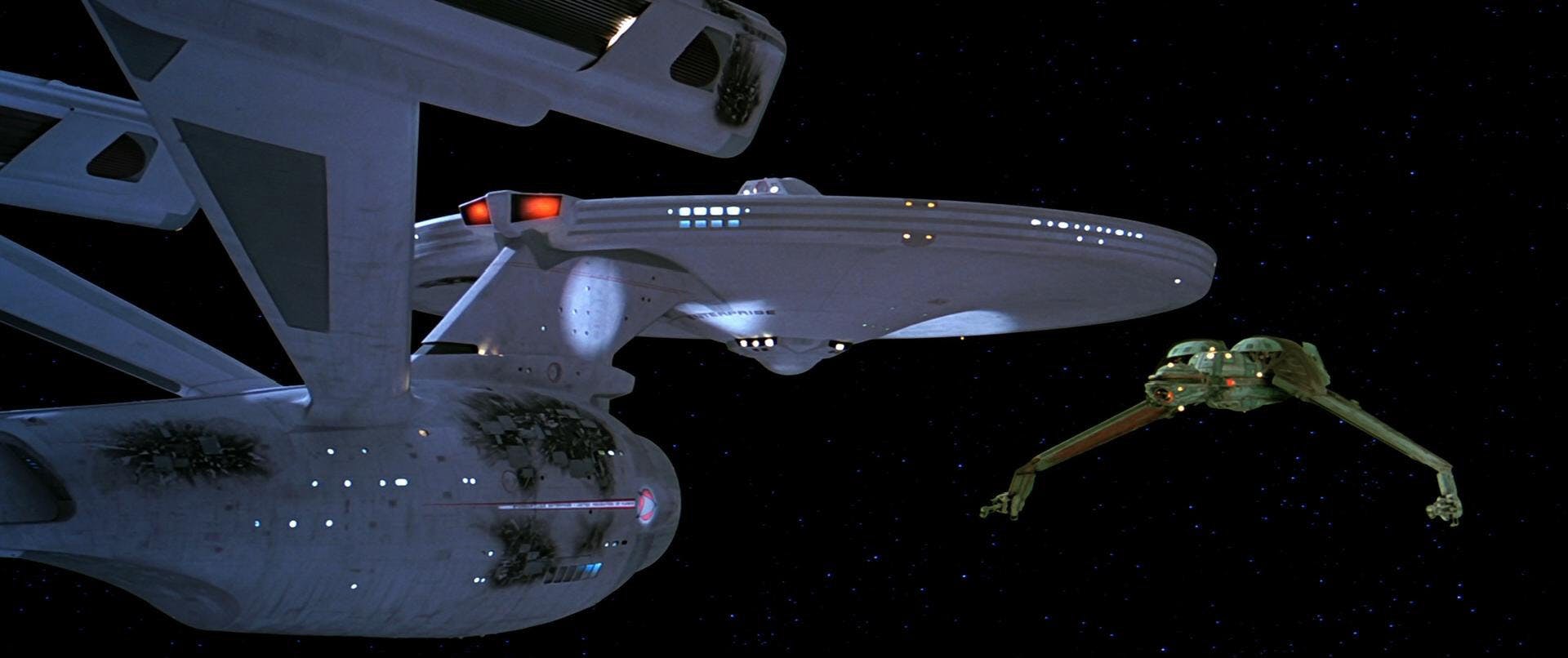 A battered Enterprise faces the Klingon Bird-of-Prey in Star Trek III: The Search for Spock