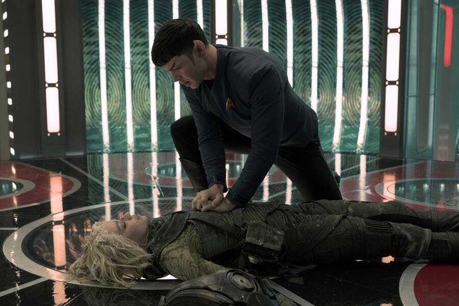 A frozen Christine Chapel lays on the transporter pad as Spock tries to resuscitate her in 'The Broken Circle'
