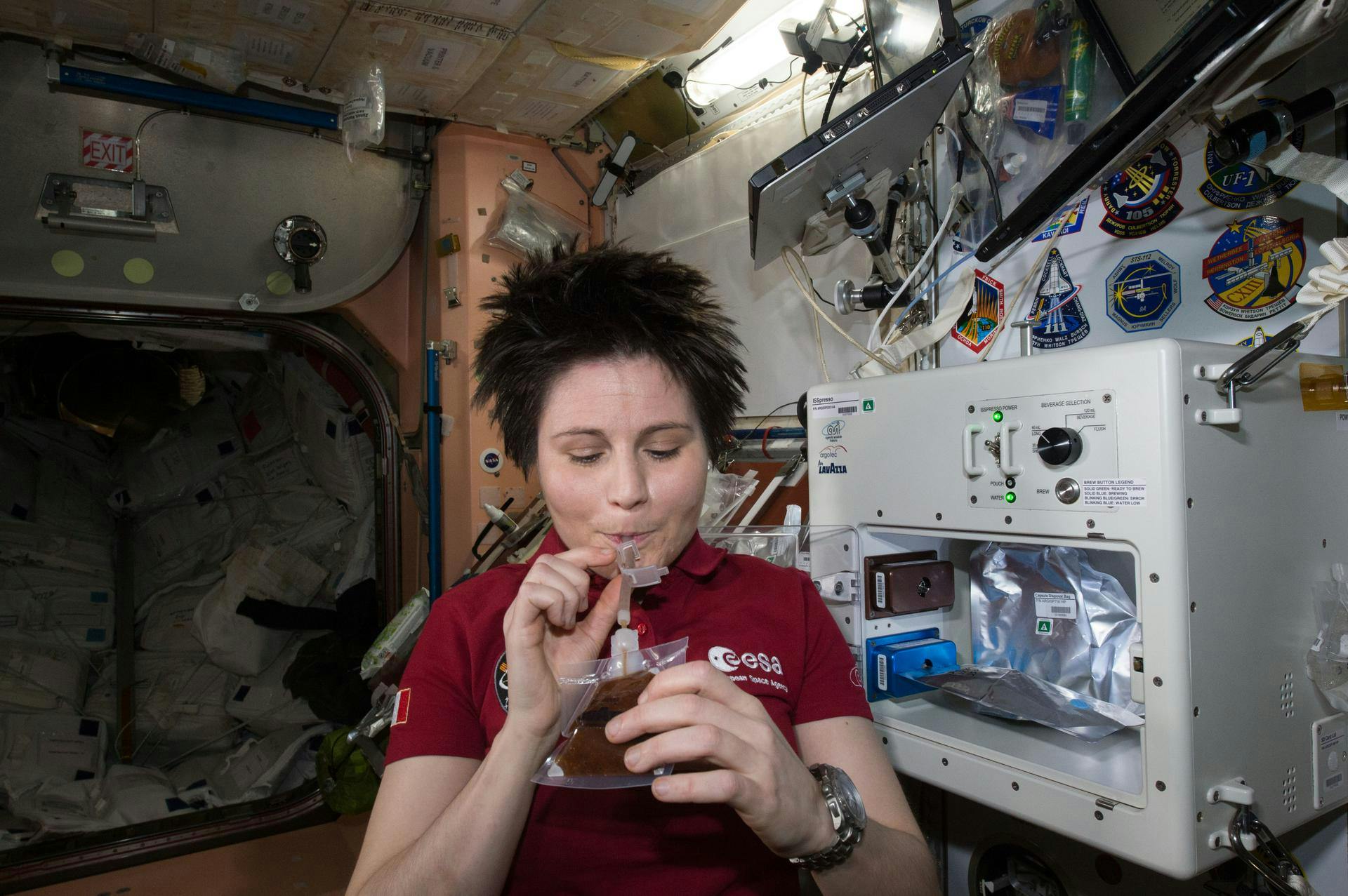 ESA (European Space Agency) astronaut Samantha Cristoforetti enjoys her first drink from the new ISSpresso machine. The espresso device allows crews to make tea, coffee, broth, or other hot beverages they might enjoy.