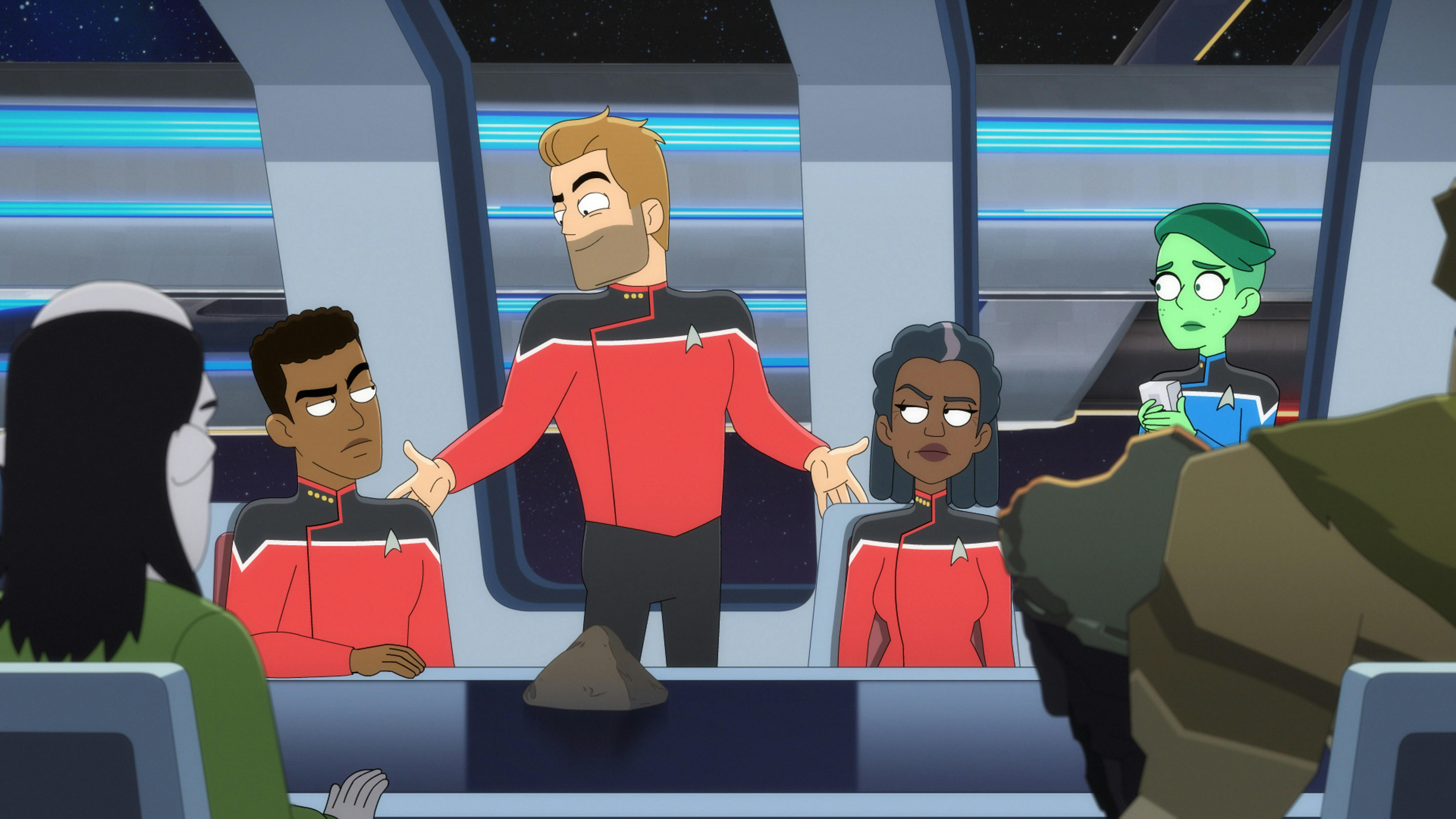 Commander Ransom poses for an unimpressed table of officers, including Captain Freeman and a worried Tendi.