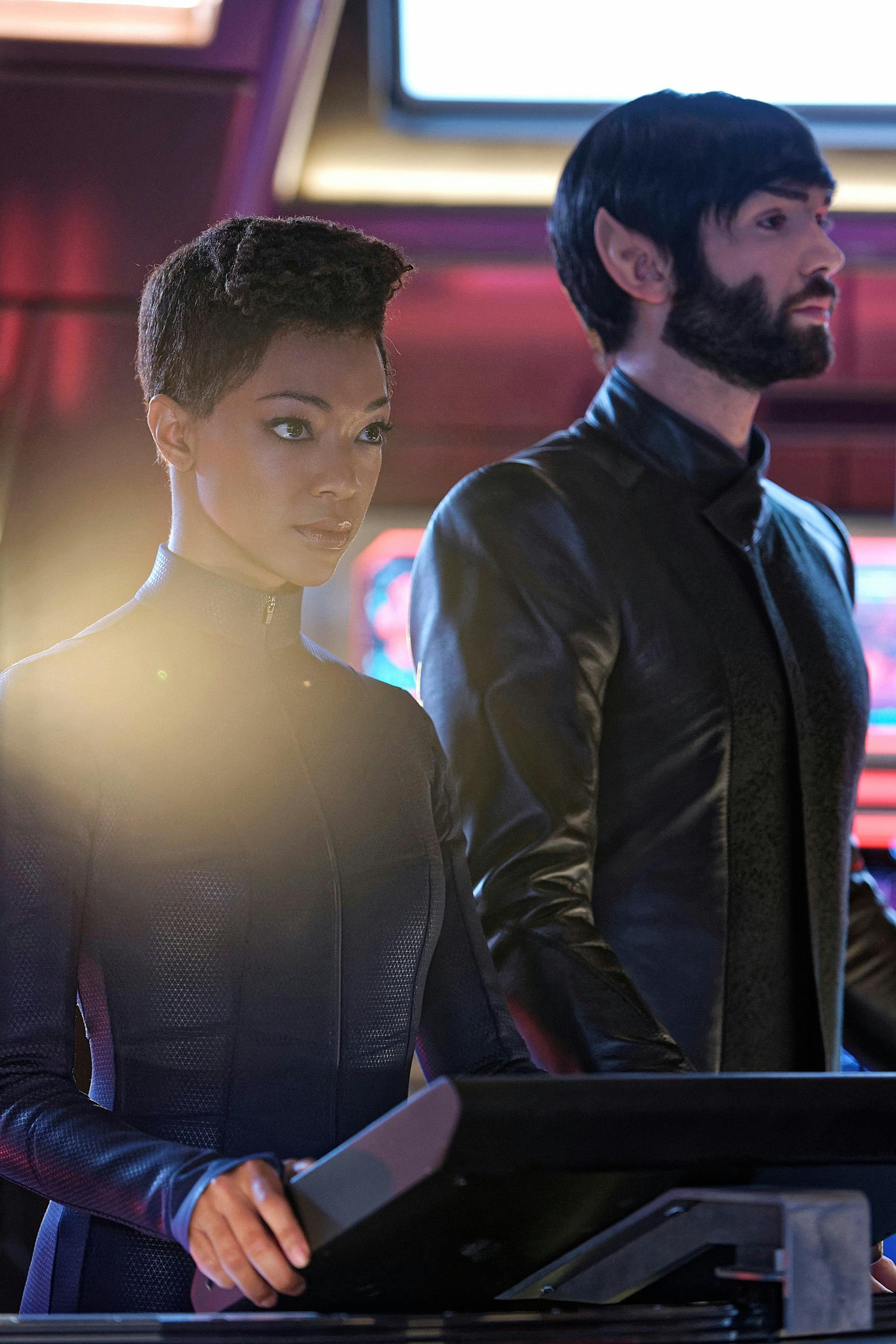 Michael Burnham and Spock stand side-by-side at their station on the Bridge of the Discovery in 'Such Sweet Sorrow'