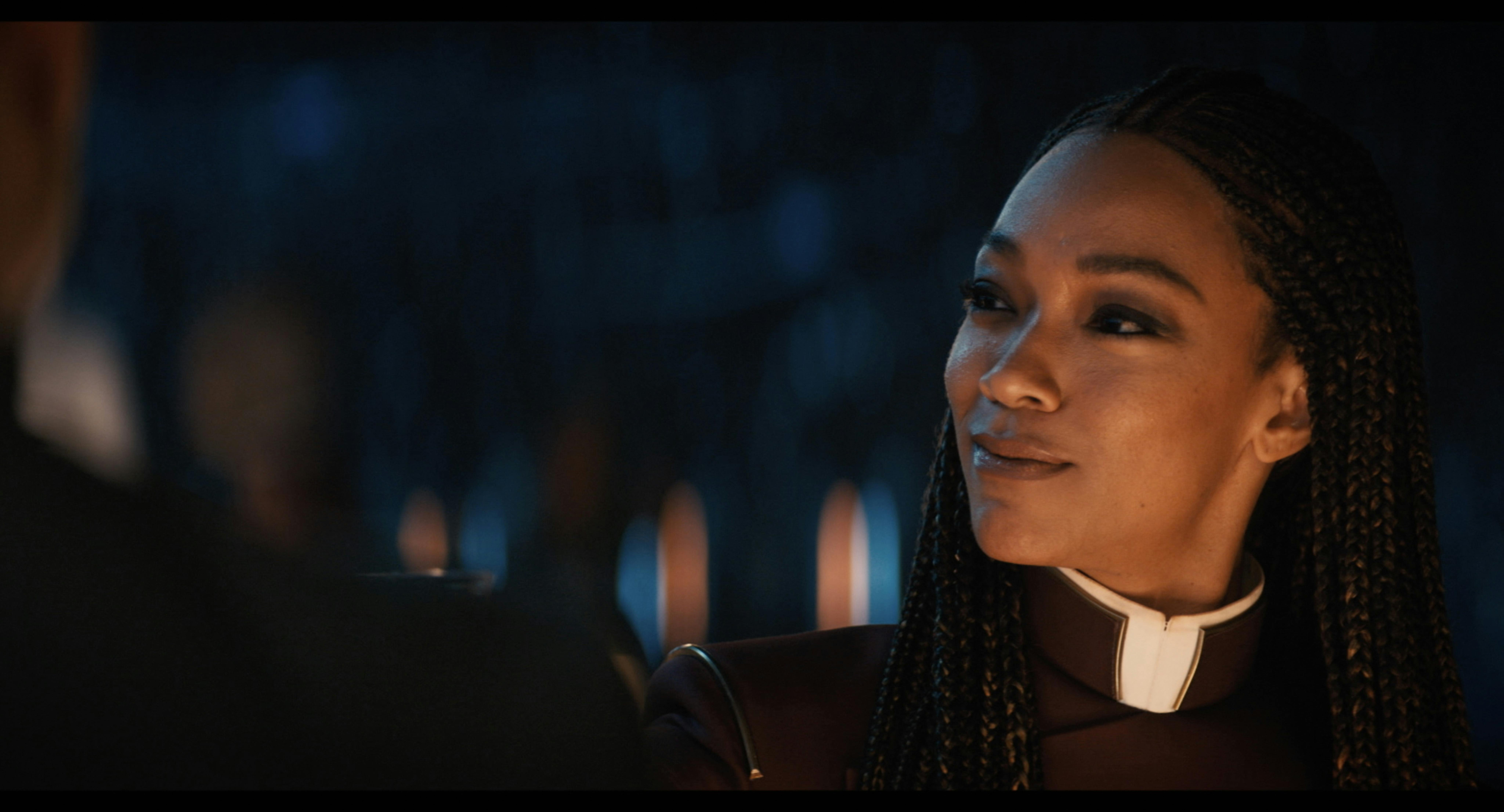 Michael Burnham looks off to the side and smiles - Star Trek: Discovery