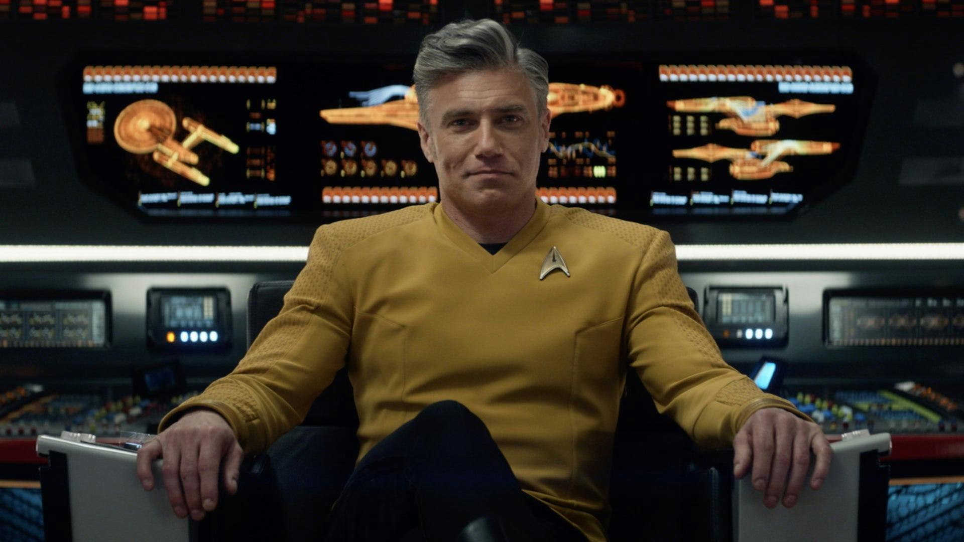 Captain Christopher Pike, Anson Mount, in the Strange New Worlds Captain's Chair 