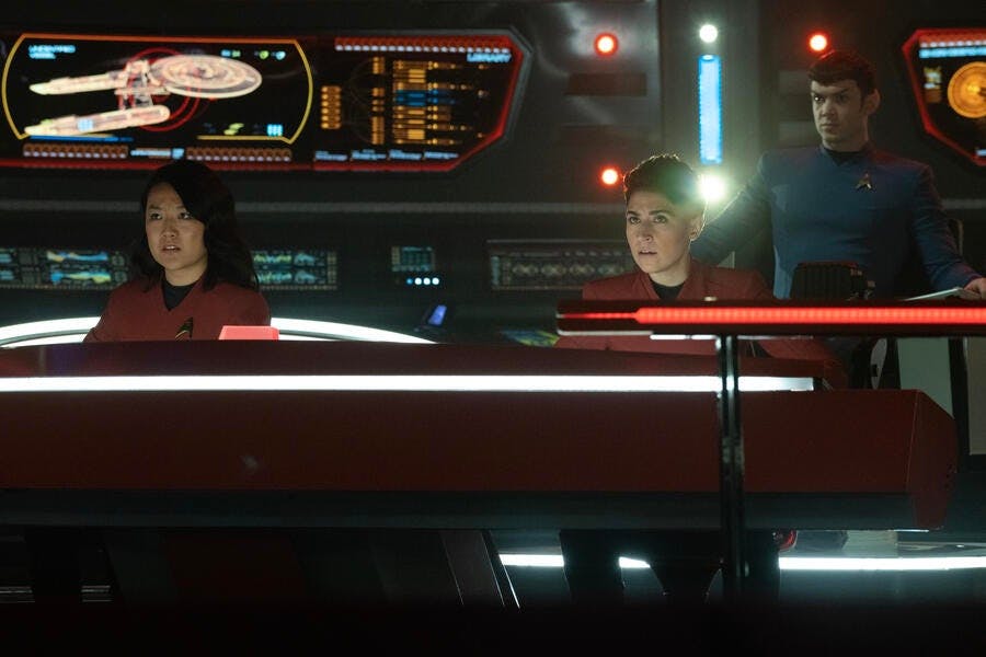 On the Bridge of the Enterprise sit Jenna Mitchell, Erica Ortegas, and Spock in the captain's chair in 'The Broken Circle'
