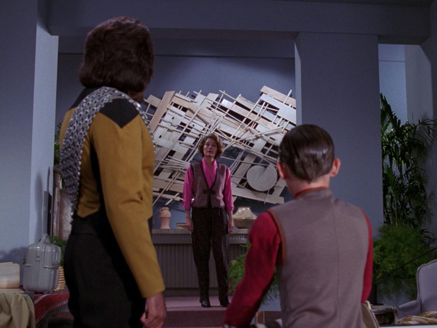 Worf and Jeremy Aster look at the alien who recreated his mother Maria Aster in The Next Generation's The Bonding