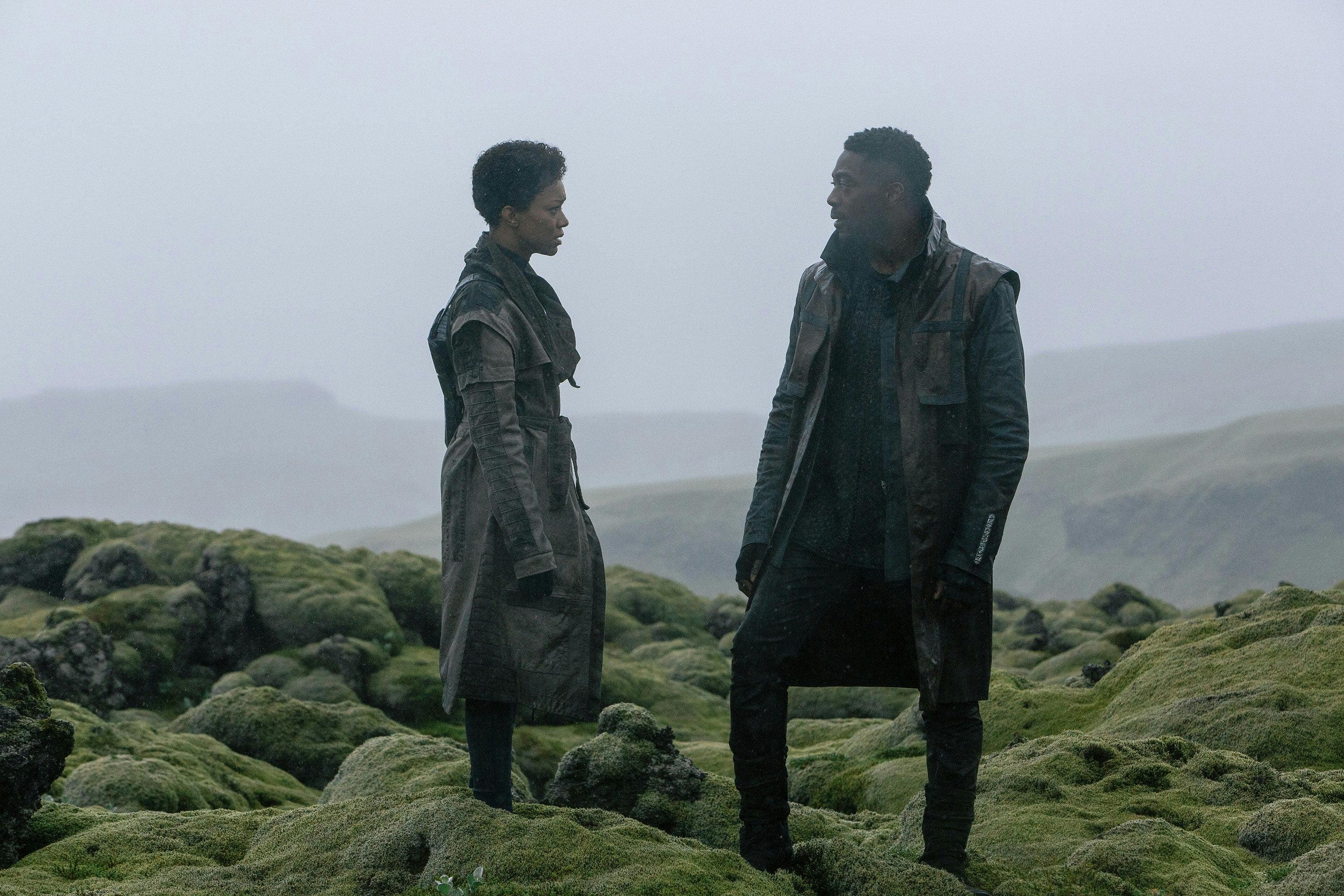 Sonequa Martin-Green and David Ajala are on a hillside in Star Trek: Discovery Season 3