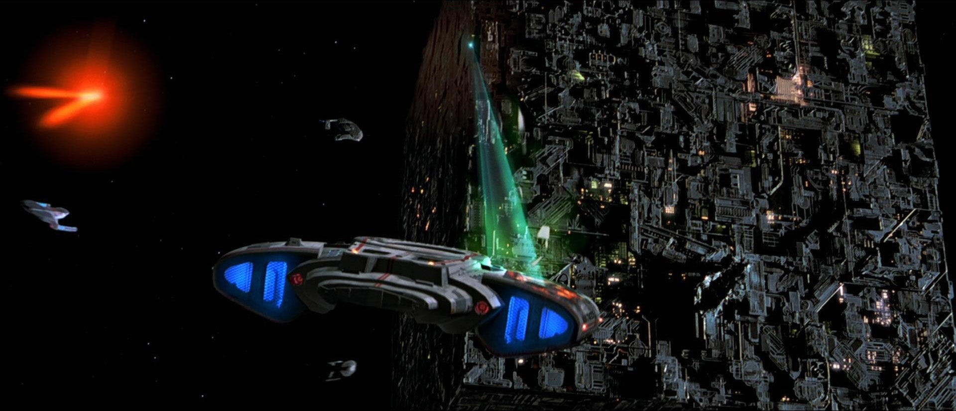 Federation ships approach the Borg Cube as it scans them in Star Trek: First Contact