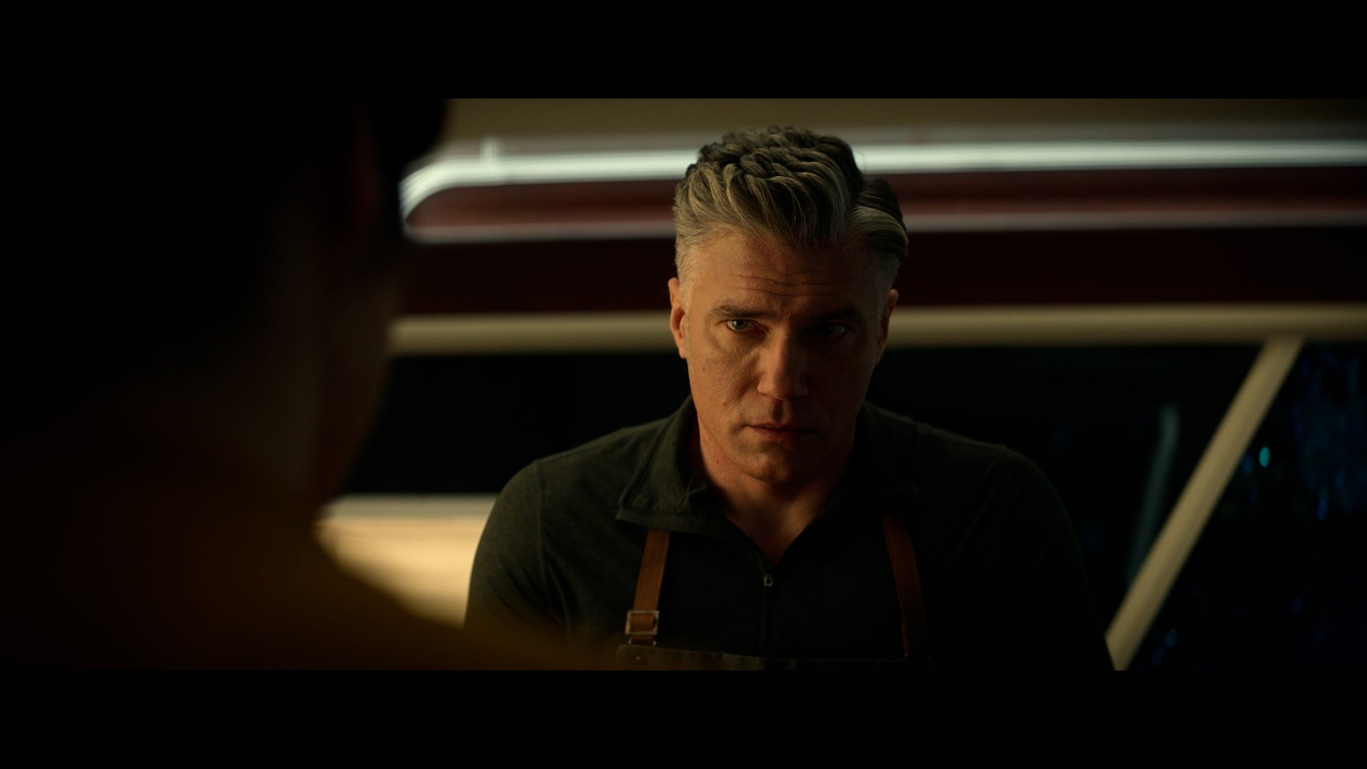 Chris Pike looks up from chopping carrots at Batel in 'Ad Astra per Aspera'