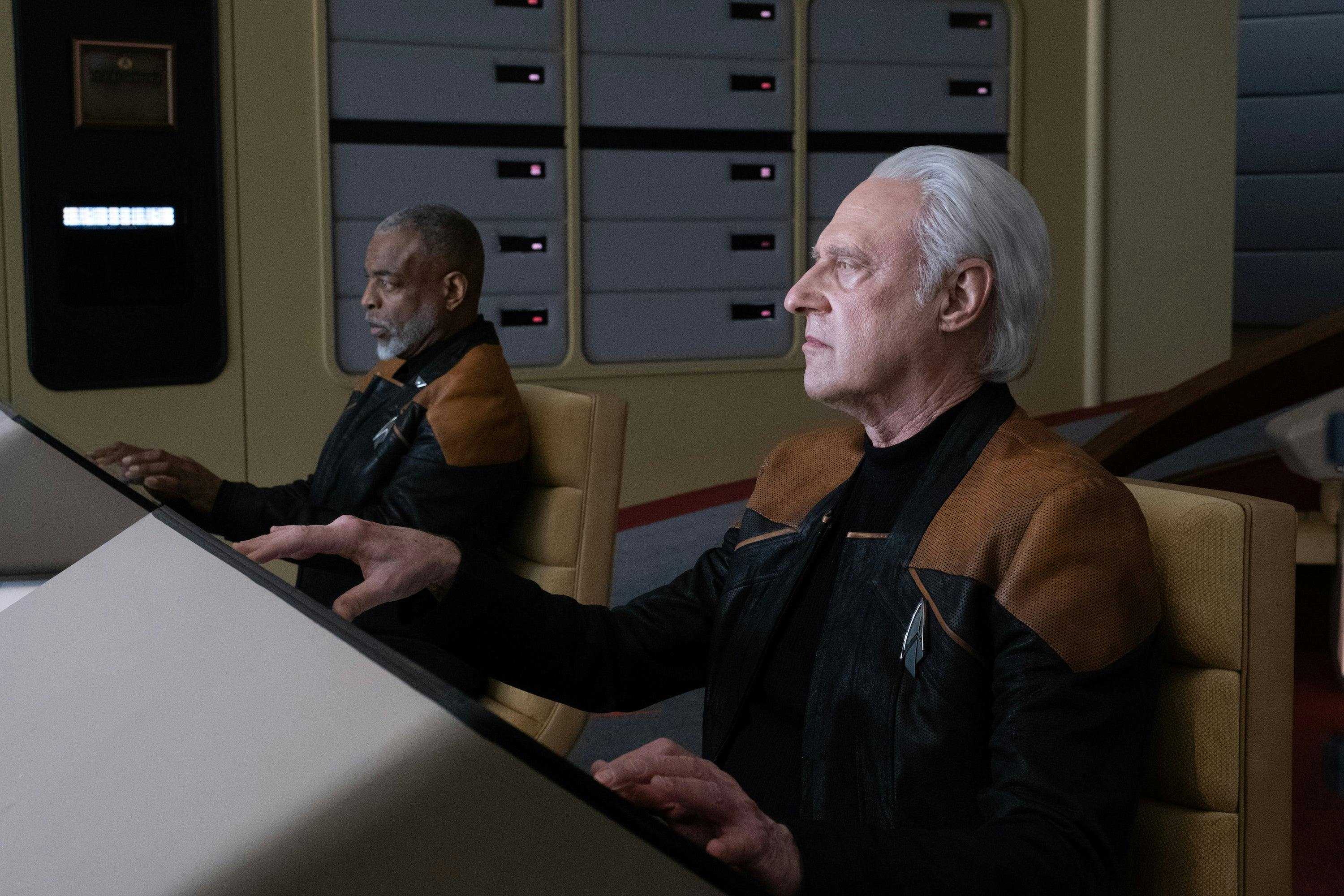 Geordi La Forge and Data sit at the helm and navigation aboard the reconstructed Enterprise-D in 'Vox'