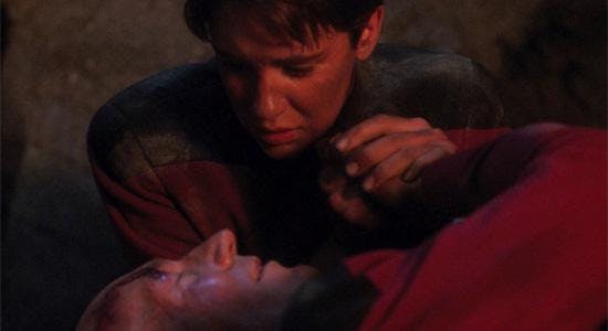 Wesley Crusher worries over a badly injured Picard while they're trapped on the desert moon of Lambda Paz
