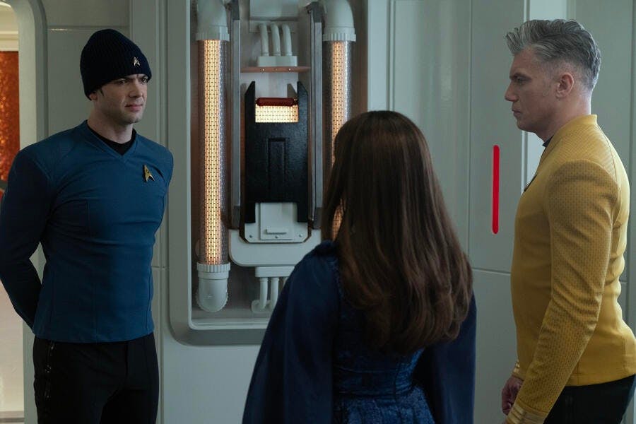 Spock wearing a regulation-issued beanie greets his mother Amanda Grayson and Captain Pike in the Transporter Room in 'Charades'