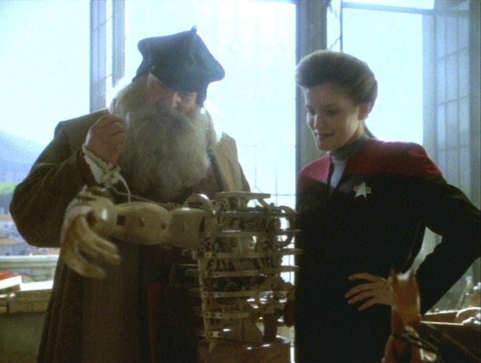 Janeway and Leonardo da Vinci look at an invention in Star Trek: Voyager