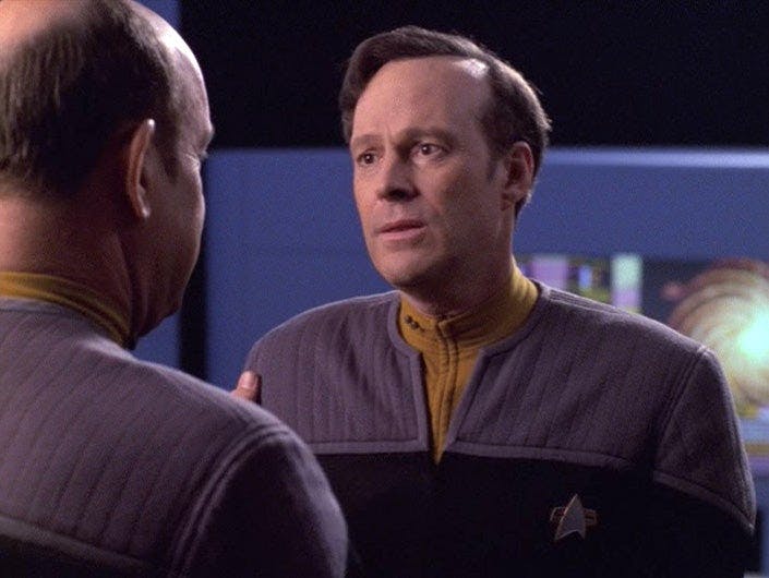 Star Trek: The Next Generation - Owen Paris puts his hand on Reginald Barclay's arm in 'Pathfinder'