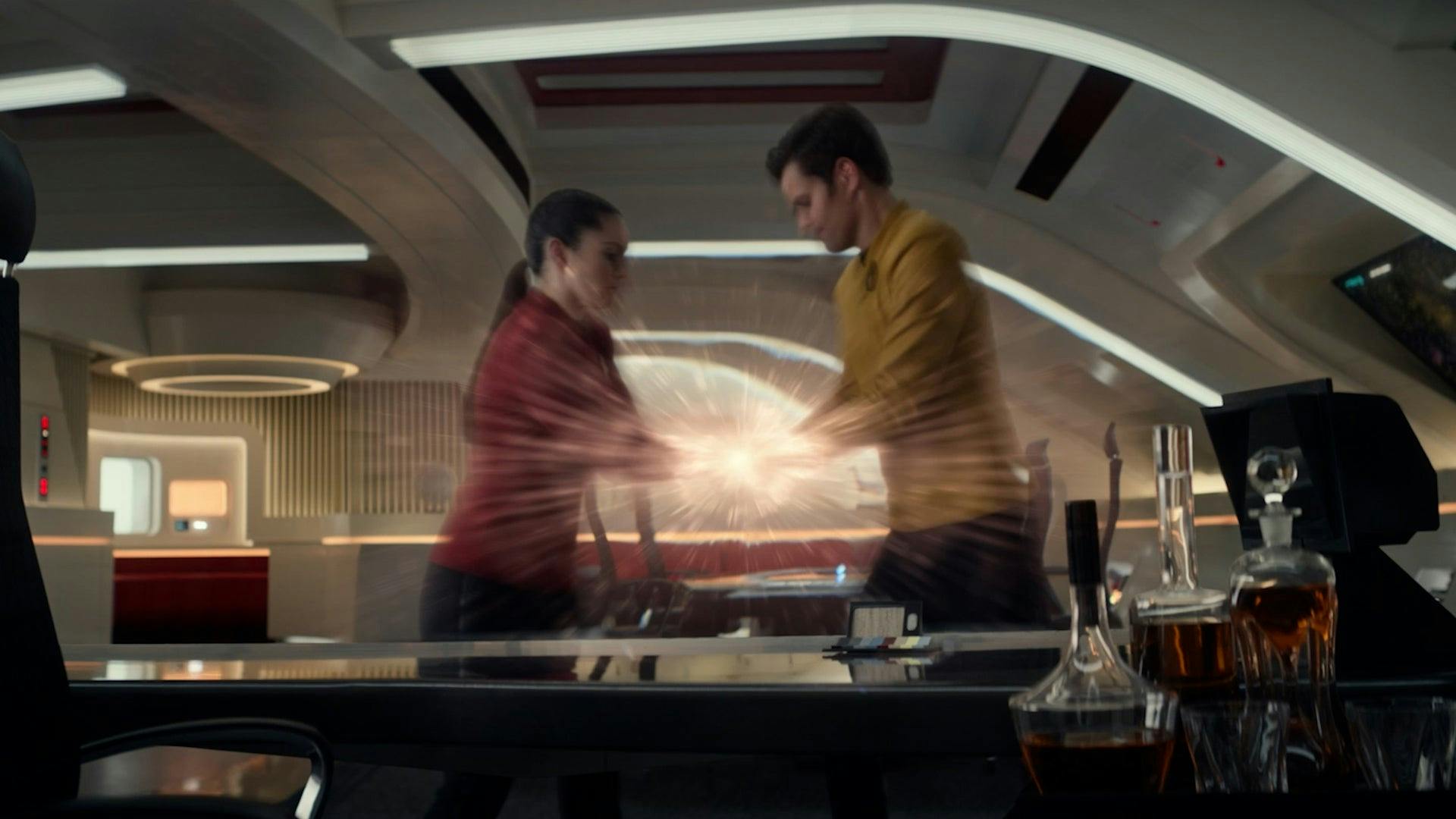 La'An and James Kirk are transported while both grabbing a temporal device in 'Tomorrow and Tomorrow and Tomorrow'