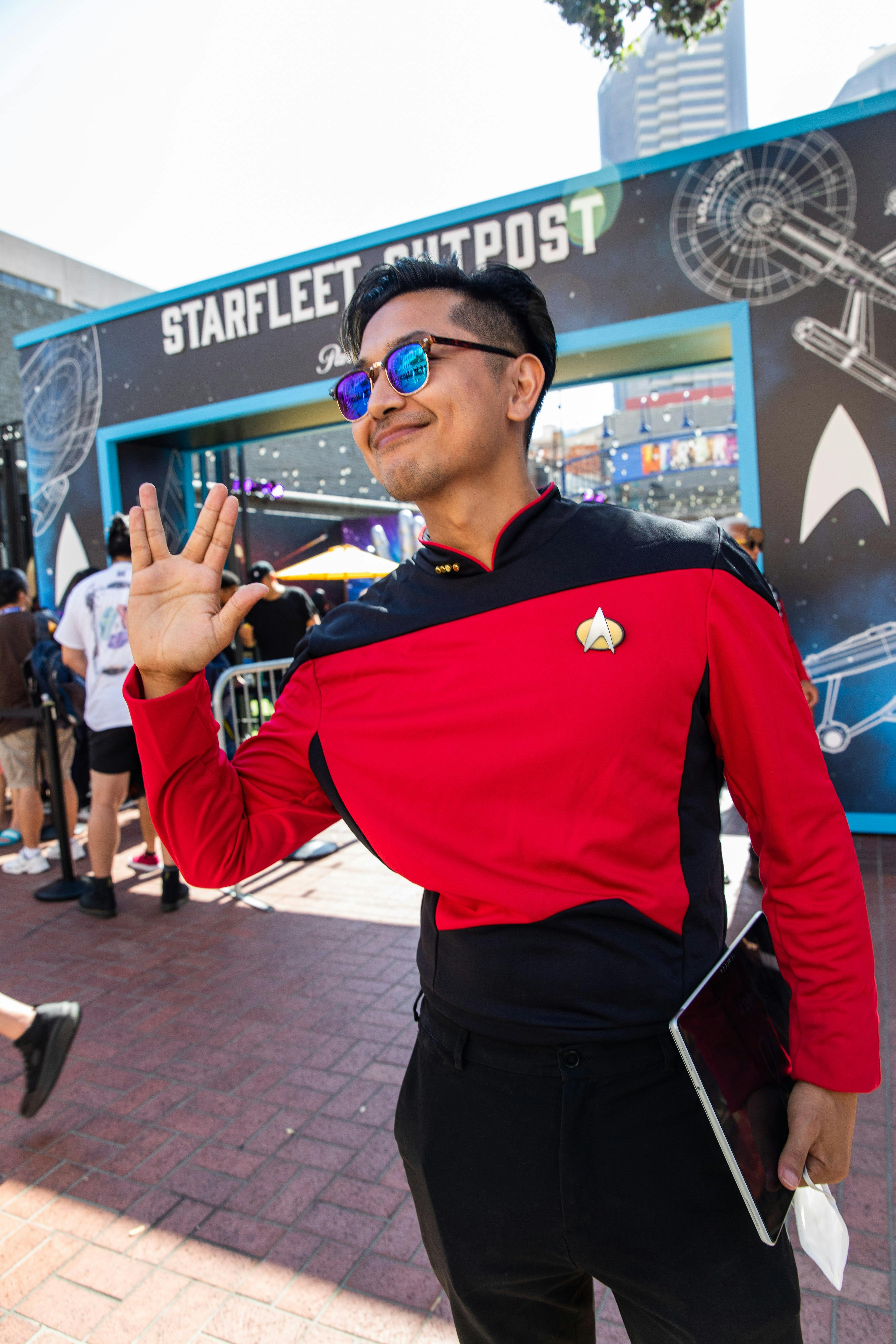 A fan gives the camera a Vulcan salute.