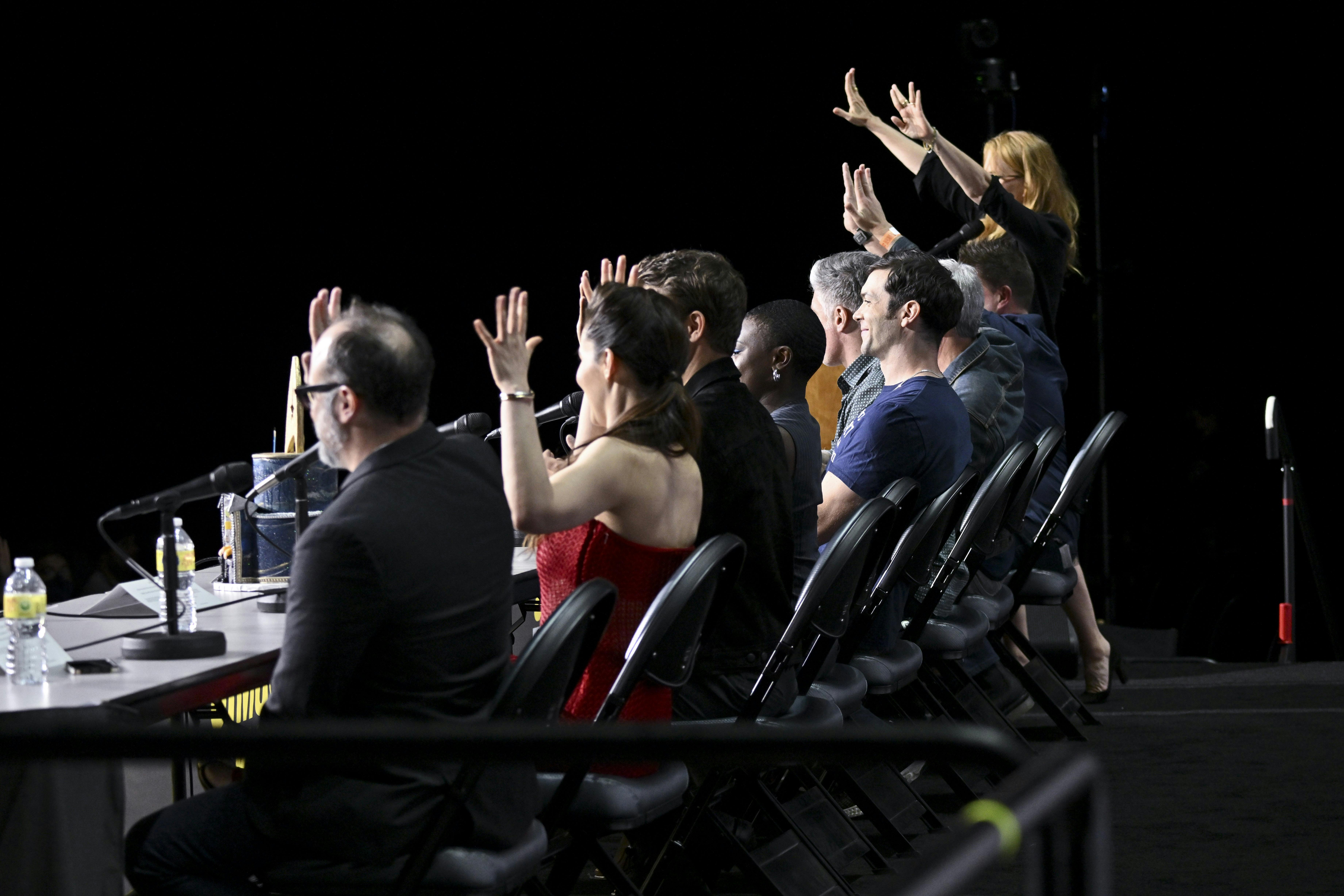 The panelists give the audience Vulcan salutes as they finish the panel.
