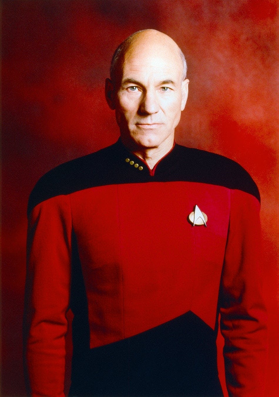 Sir Patrick Stewart poses as Captain Jean-Luc Picard for Star Trek: The Next Generation's Season 3 promotional cast portrait
