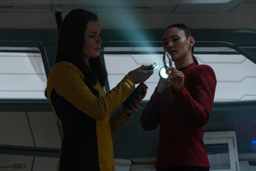 Una Chin-Riley and La'An inspect the shuttle and come across a suspicious calling card in 'Charades'