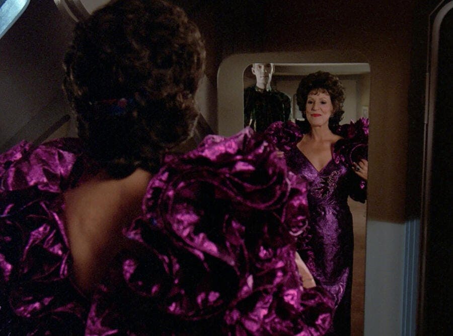 Lwaxana Troi admires her fabulous pink gown in 'Manhunt'