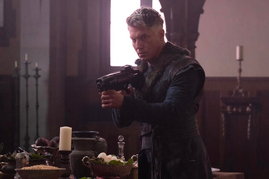 Christopher Pike stands in defense with a phaser rifle in 'Among the Lotus Eaters'