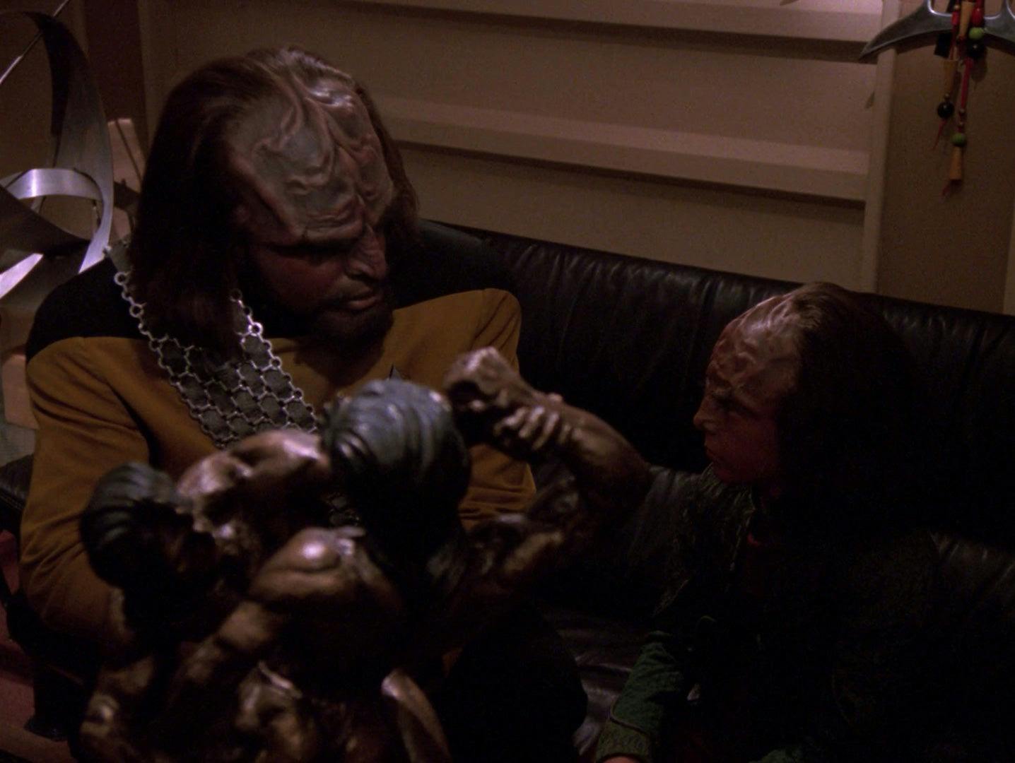 On the couch, Worf sits besides son Alexander for a talk on Star Trek: The Next Generation
