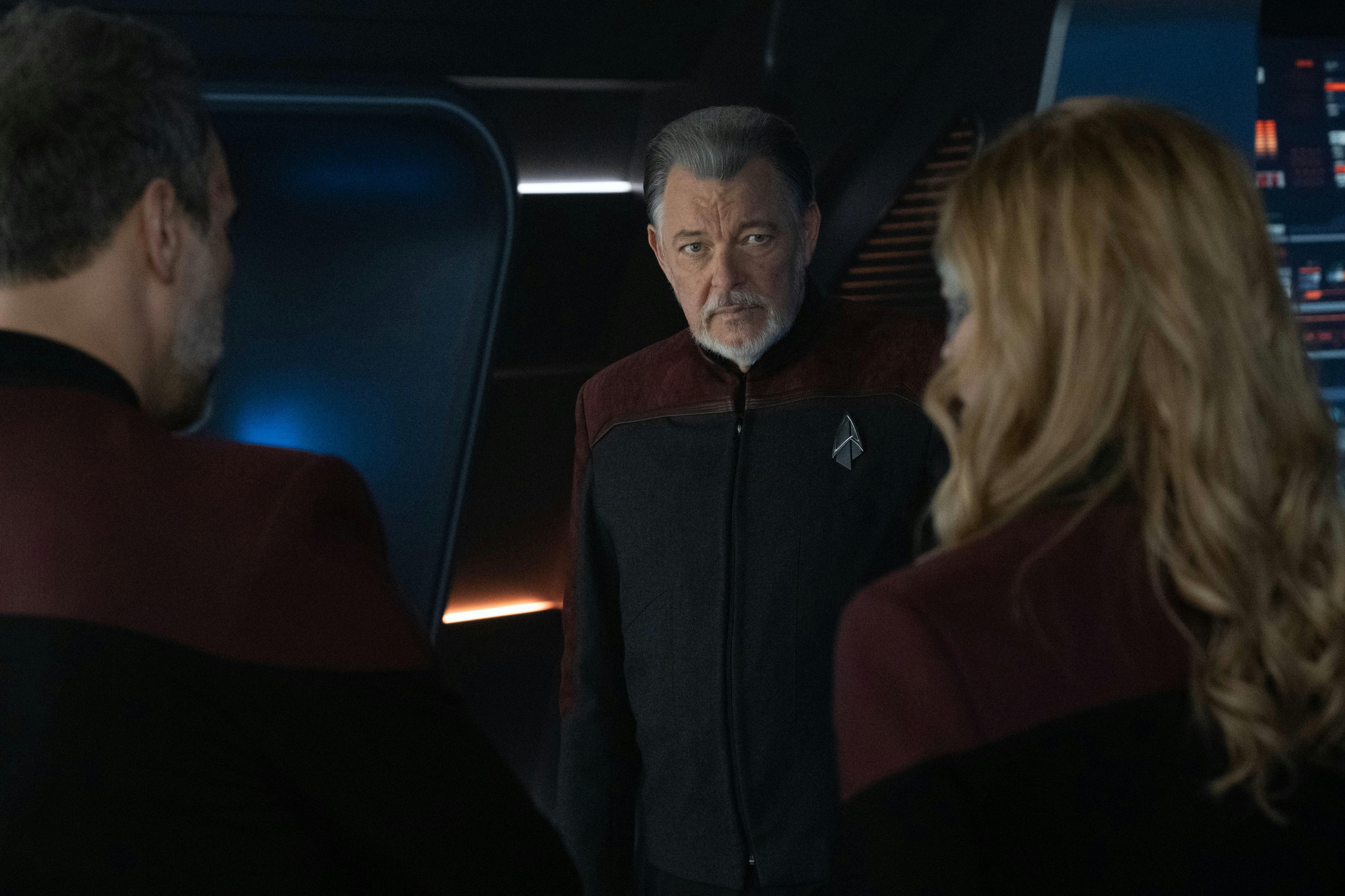 A stern Riker faces Shaw and Seven who have their backs to us on Star Trek: Picard