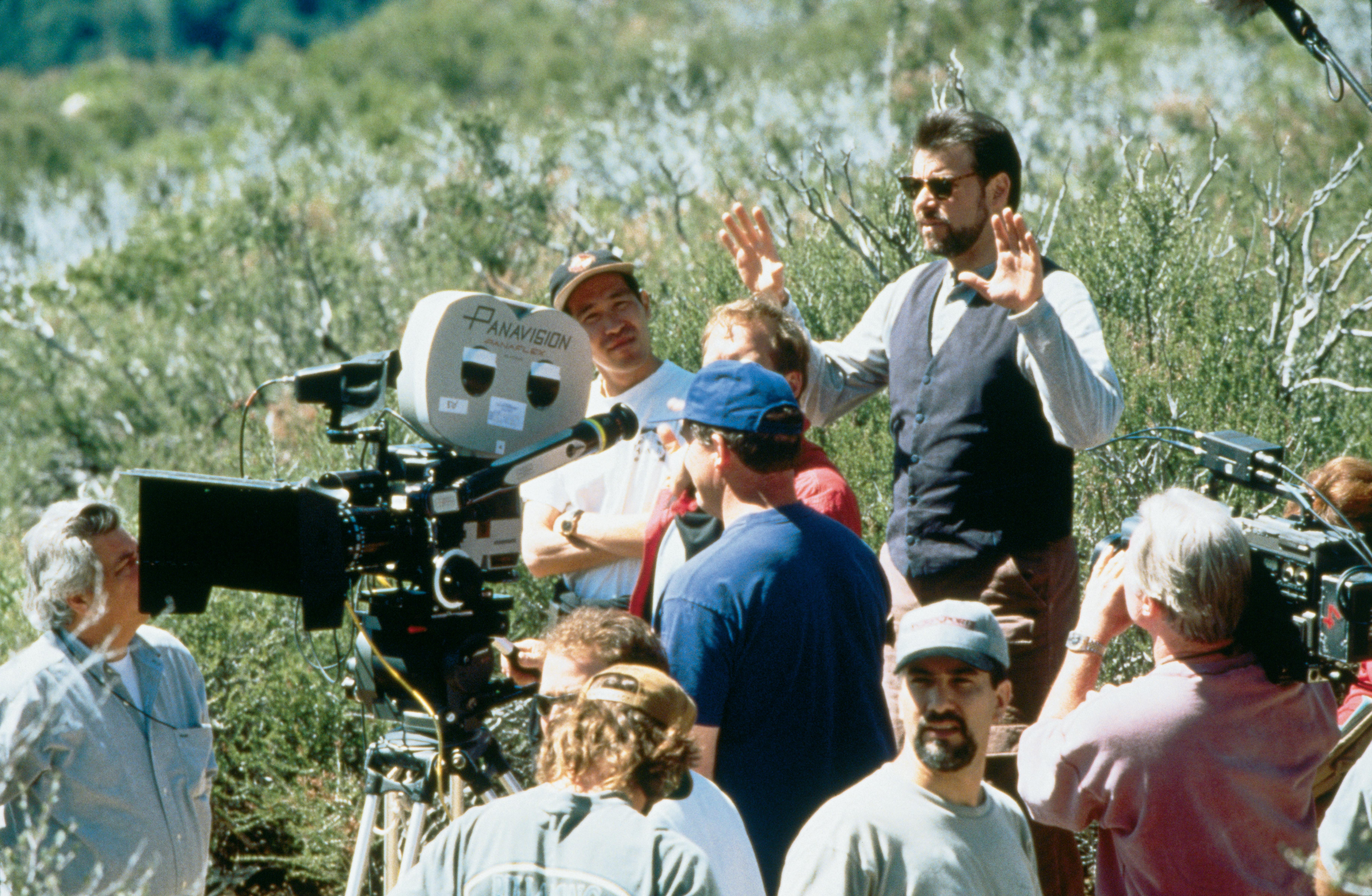 Jonathan Frakes directing a scene in First Contact, standing behind the camera, with crew around him.