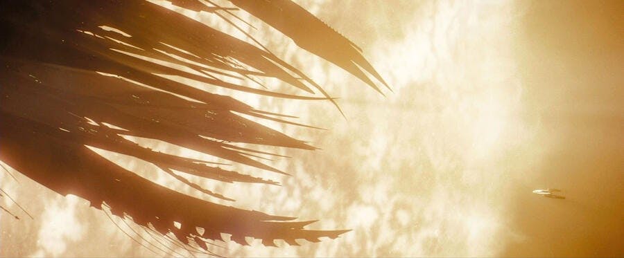 The massive Narada emerges from a wormhole and appears before the U.S.S. Kelvin
