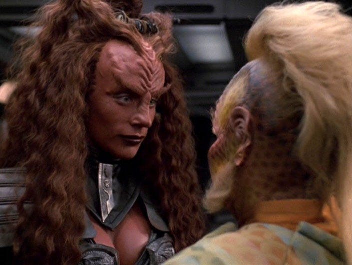 The Klingon officer Ch'Rega stares at Neelix with intense interest in 'Prophecy'