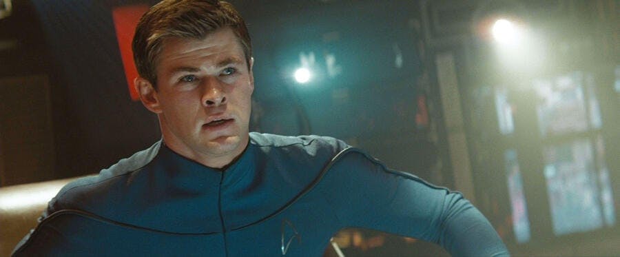 George Kirk sits in the captain's chair of the Kelvin in Star Trek (2009)
