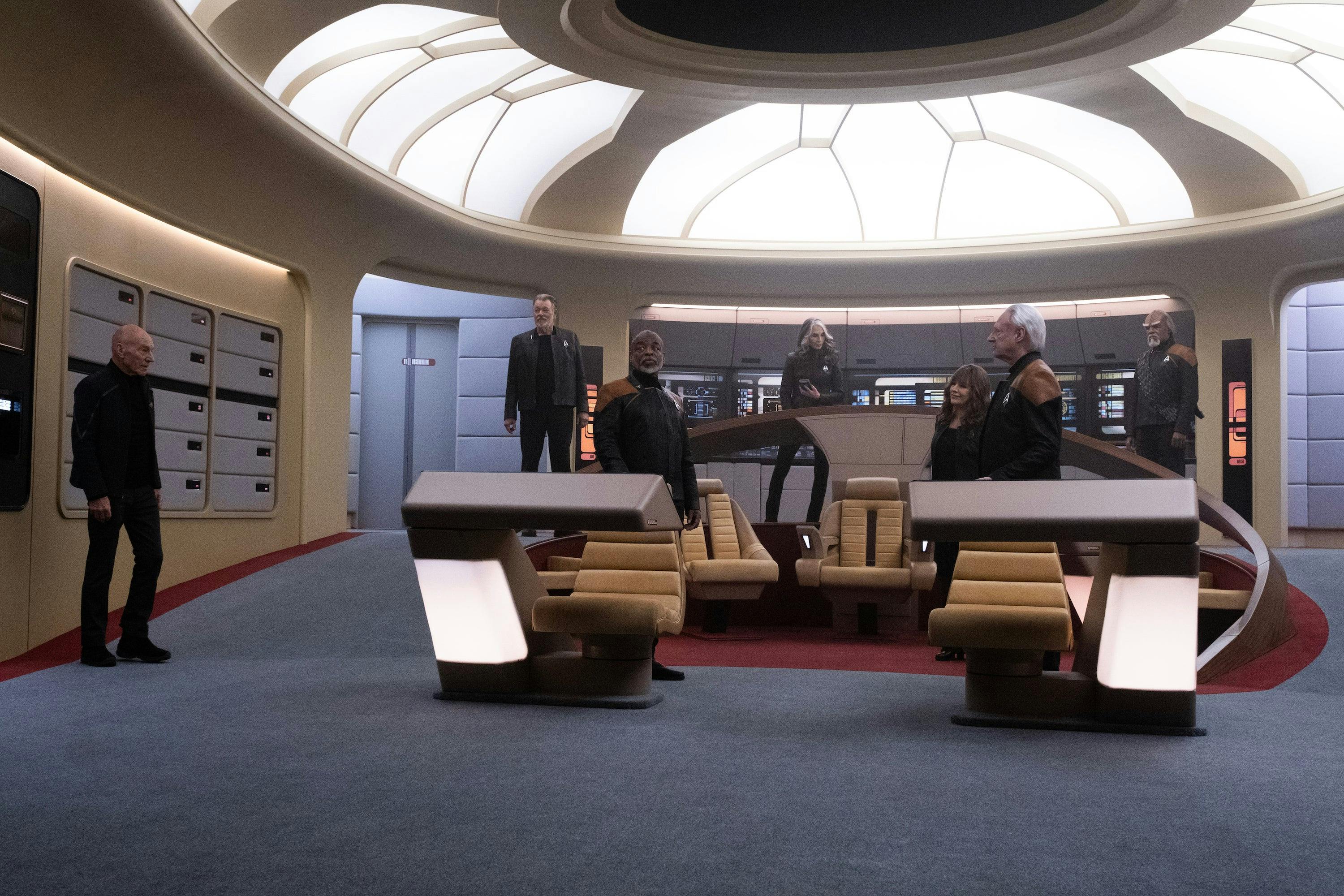 Riker, Geordi, Beverly, Picard, Deanna, Worf, and Data stand on the Bridge of the reconstructed Enterprise-D in 'Vox'